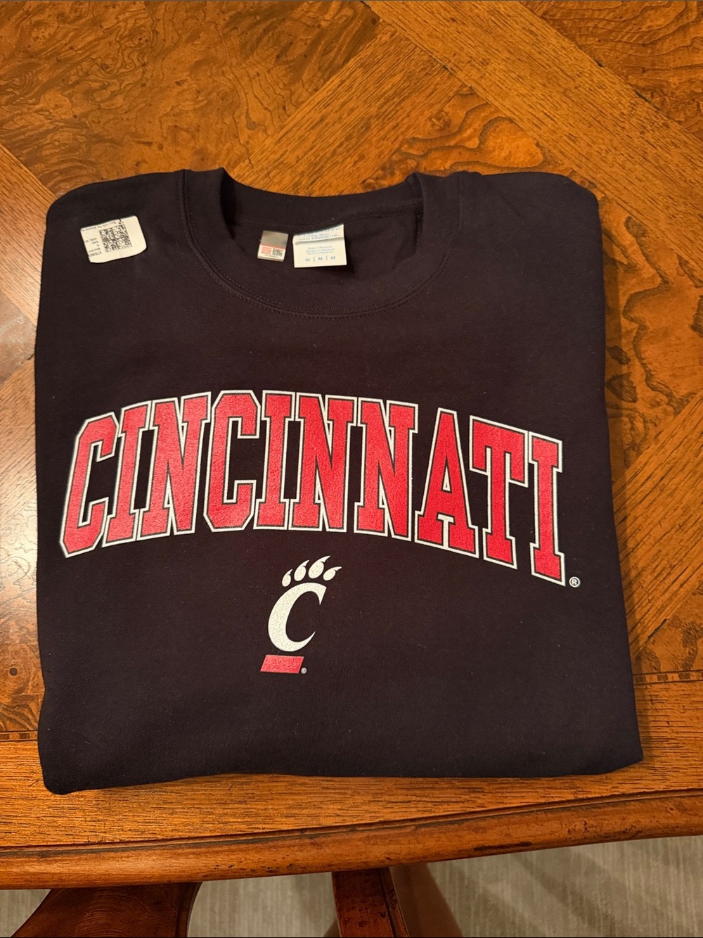 Never worn unisex size M Cincinnati Black Crewneck Sweatshirt with Red Logo